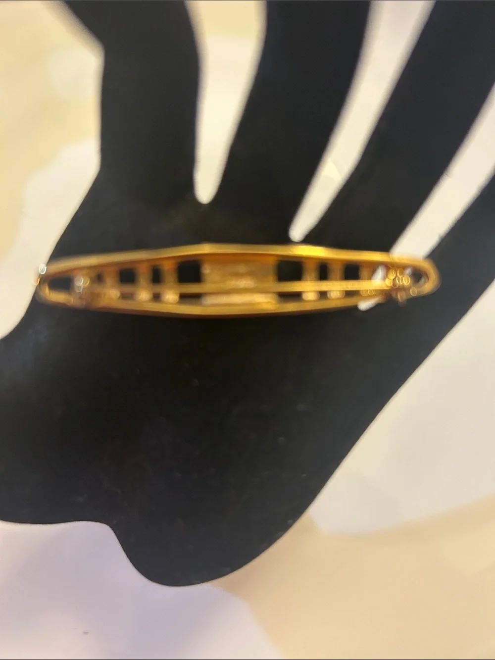 Monet vintage gold-tone tie bar features an openwork geometric design. 2 1/2”